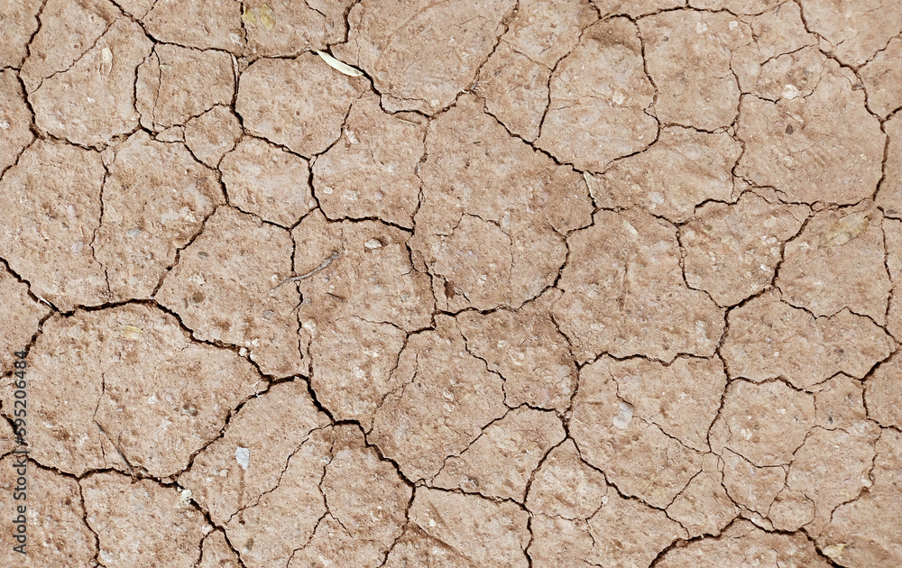 Cracked ground background in the top view for graphic design or wallpaper Cracked ground background in the top view for graphic design or wallpaper