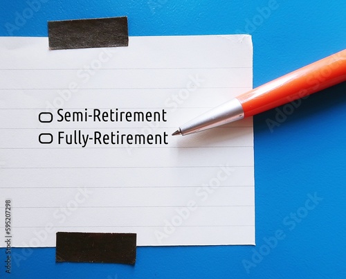 Pen ticking on checkboxes befor two choices SEMI-RETIREMENT VS FULLY-RETIREMENT, concept of modern trend when significant number of retirees plan to work part-time after they retire photo