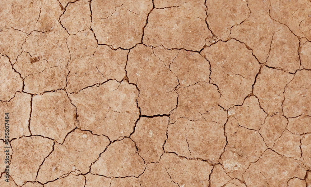 Cracked ground background in the top view for graphic design or wallpaper Cracked ground background in the top view for graphic design or wallpaper