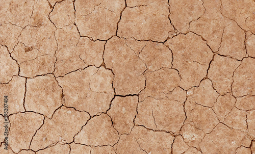 Cracked ground background in the top view for graphic design or wallpaper