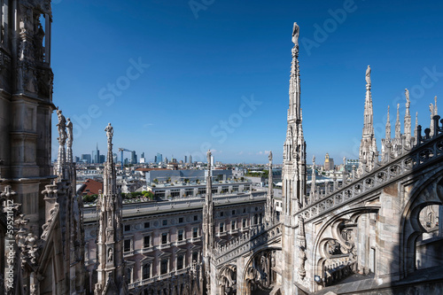 Rooftop of Duomo di Milano or Milan Cathedral with spires and statues © tapanuth