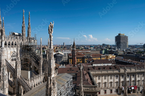 Rooftop of Duomo di Milano or Milan Cathedral with spires and statues © tapanuth