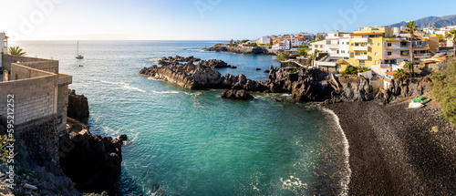 Alcalá in Tenerife with its cove and pebble beach framed by a rocky coastline creating a scenic beauty that is sure to capture the heart of any romantic traveler seeking an escape from everyday life.