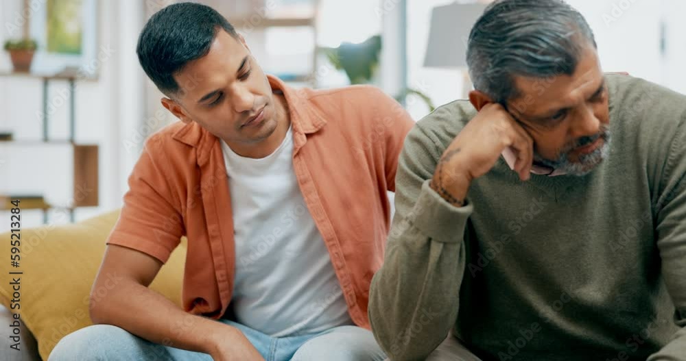Depression, trust or empathy with a father and son talking in the living room to comfort, console or care. Family, love and support with young man helping a senior parent through pain, grief or loss Depression, trust or empathy with a father and son talking in the living room to comfort, console or care. Family, love and support with young man helping a senior parent through pain, grief or loss