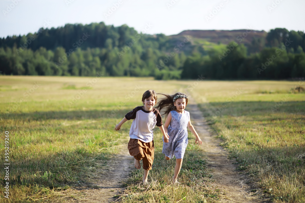 Children walk in the summer in nature. Child on a sunny spring morning in the park. Traveling with children. Children walk in the summer in nature. Child on a sunny spring morning in the park. Traveling with children.