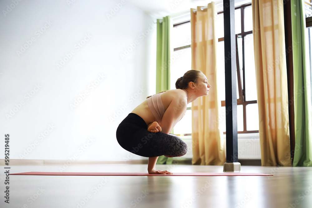 Girl doing yoga in the studio Girl doing yoga in the studio