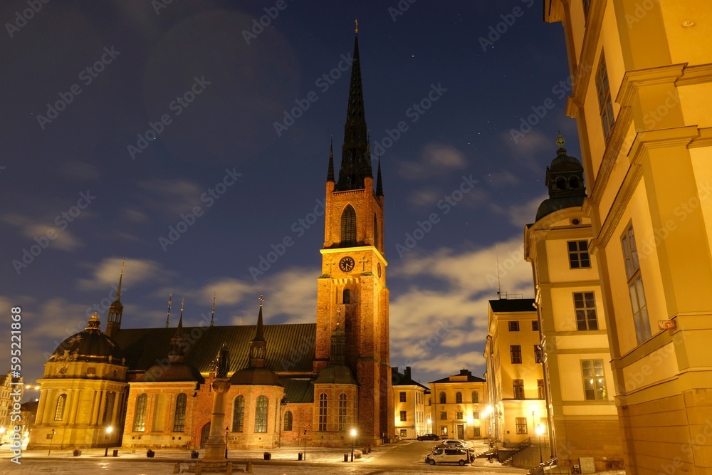 Beautiful scenery of illuminated Stockholm by night. Riddarholmen Church, located on Riddarholmen Island, next to the Royal Palace in Stockholm, Sweden.