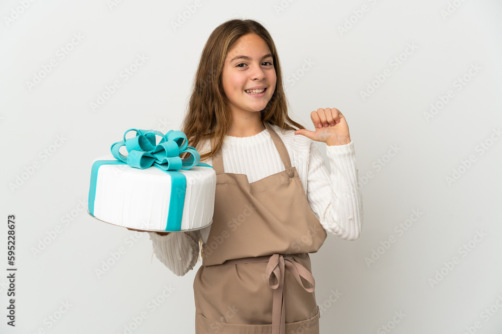 Little girl holding a big cake over isolated white background proud and self-satisfied Little girl holding a big cake over isolated white background proud and self-satisfied