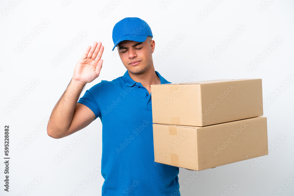 Delivery caucasian man isolated on white background making stop gesture and disappointed Delivery caucasian man isolated on white background making stop gesture and disappointed