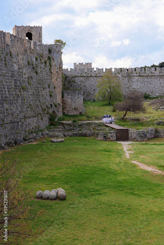 Grass along the World City Trail  walking path at the moat underneath the Gate of Amboise at Rhodes famous Old town photo