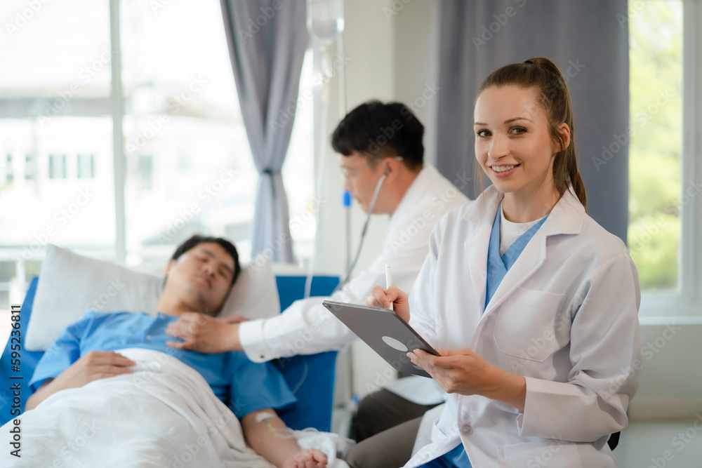 doctor team talking with man patient for monitoring and check up after surgery. doctor touching patient hand and consoling. doctor team talking with man patient for monitoring and check up after surgery. doctor touching patient hand and consoling.