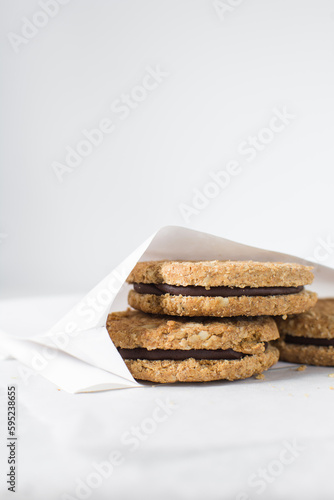 Wallpaper Mural cookies packed in white parchment bags, chocolate filled oat cookies in a bakery bag, cookies in white paper bag Torontodigital.ca