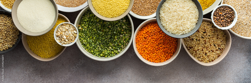 Various grain cereals in bowls banner, top view Various grain cereals in bowls banner, top view