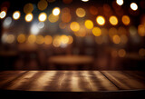 Creative interior concept. Empty wooden table top with blur light golden bokeh of cafe background. Template for product presentation display. Mock up