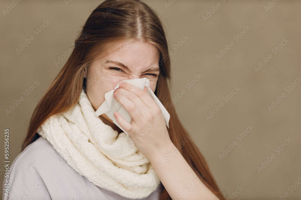 Young woman blowing nose has flu catarrh ill sick disease treatment cold Young woman blowing nose has flu catarrh ill sick disease treatment cold