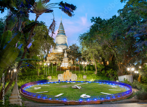 The illuminated pagoda of Wat Phnom Daun Penh Buddhist temple at sunset,Phnom Penh,Cambodia. photo