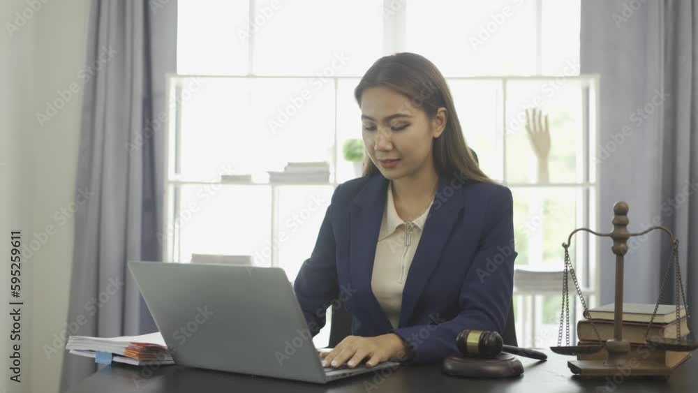 Female lawyer working with hammers and scales The goddess of injustice with the concept of online legal counseling laptops. 4k Female lawyer working with hammers and scales The goddess of injustice with the concept of online legal counseling laptops. 4k