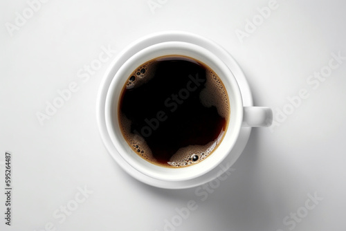 Cup of Coffee standing on a white table, view from high angle