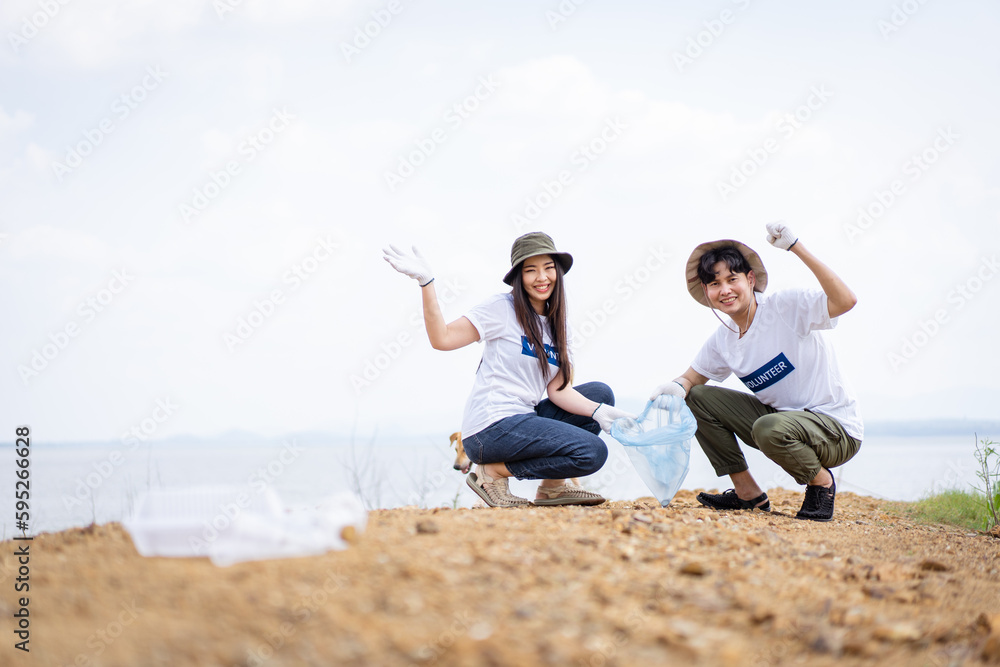 Group of Asian young people volunteer helping to collecting or picking up a plastic bottle garbage. Group of Asian young people volunteer helping to collecting or picking up a plastic bottle garbage.
