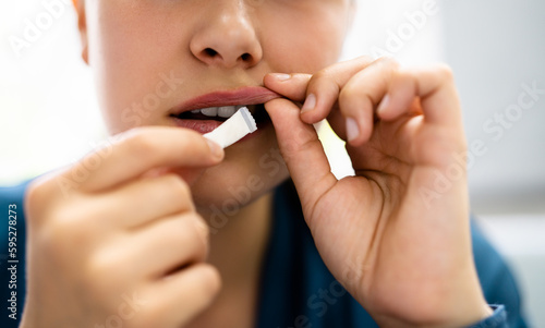 Woman Chewing Wet Moist Nicotine Product