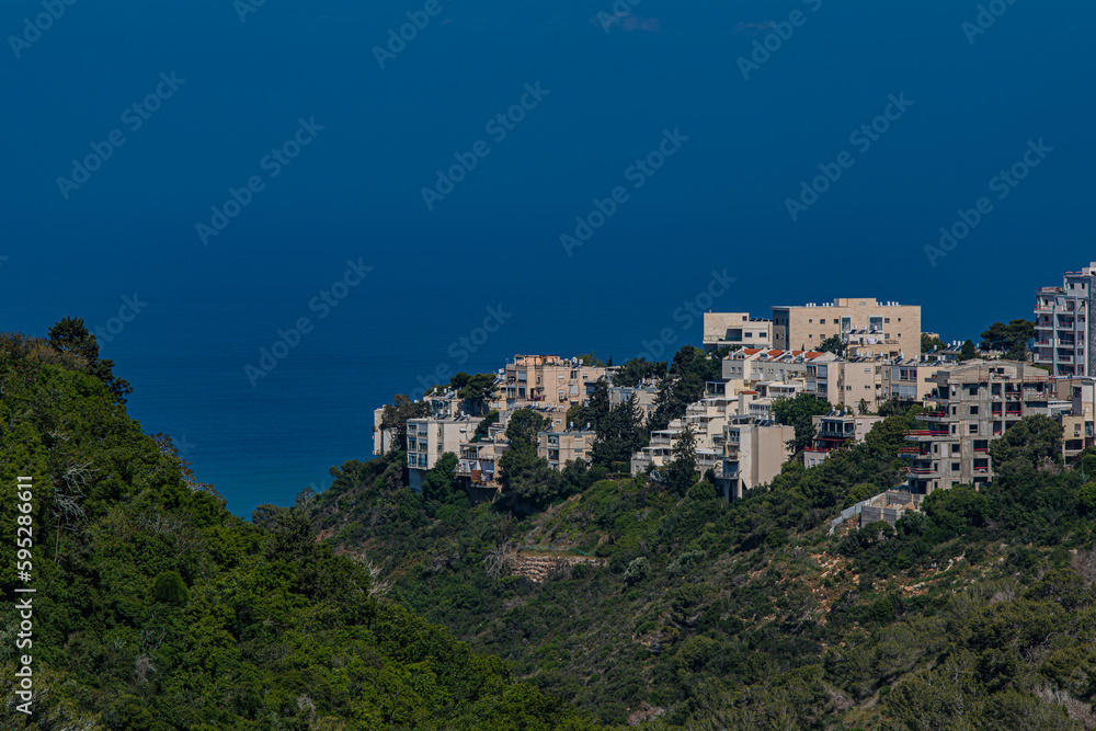 Houses on the mountain and the sea on the horizon