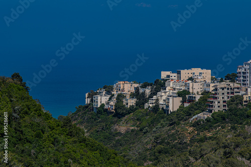 Houses on the mountain and the sea on the horizon