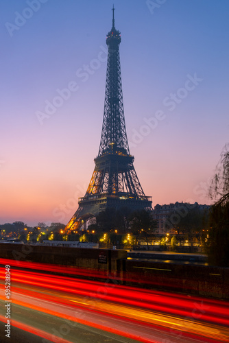 Eiffel Tower  French  Tour Eiffel  silhouette at dawn with blurred long exposure red traffic lights. Paris  France