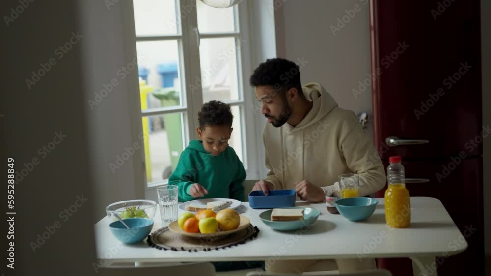 Father and son having breakfast together. Father and son having breakfast together.
