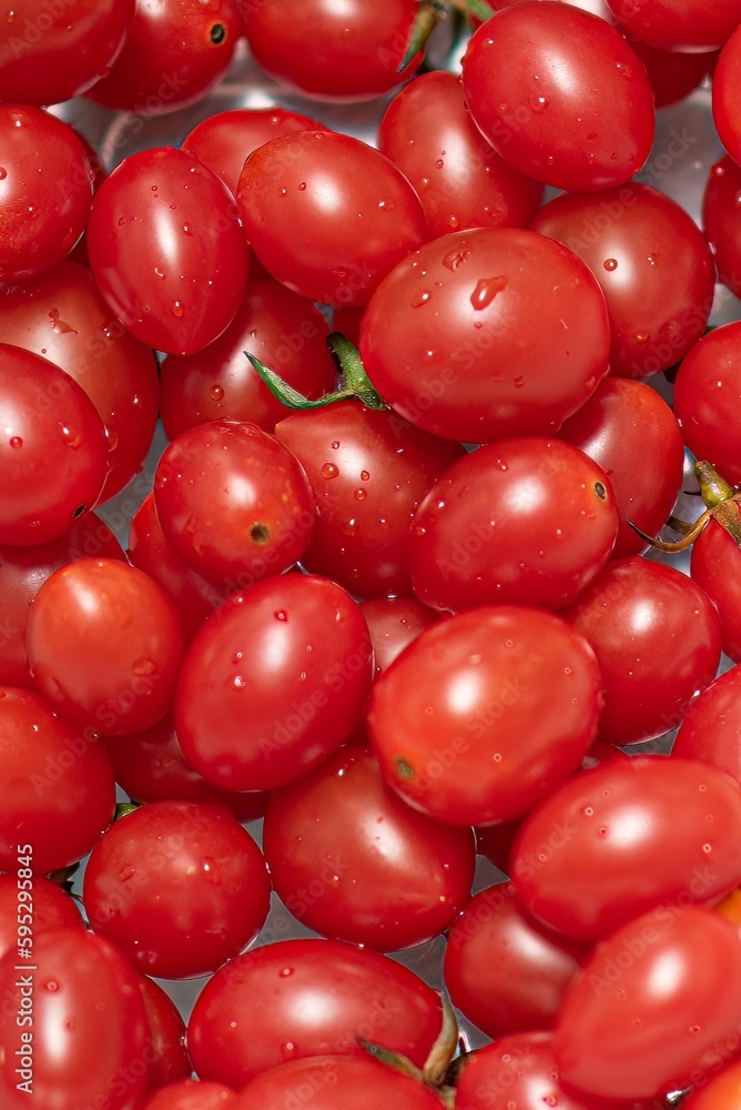 Closeup shot of a stack of juicy red cherry tomatoes. Closeup shot of a stack of juicy red cherry tomatoes.