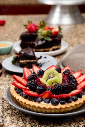 Delicious fruit tart and chocolate cake