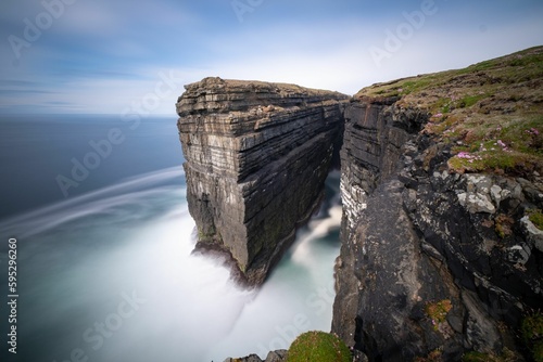 Long exposure still image of Diarmuid and Grainnes Rock at Loop Head peninsula, Ireland photo