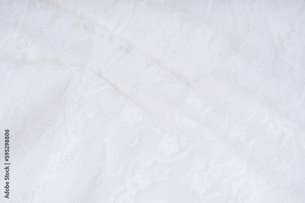 Obraz premium The white background with lace flower. Texture background pattern.