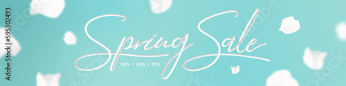 Spring sale banner on a blue background with blossom