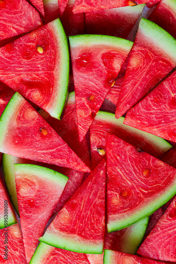Macro sliced watermelon,Red watermelon triangular piece on white blackground Macro sliced watermelon,Red watermelon triangular piece on white blackground
