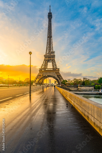 Eiffel tower from Jena Bridge, French: Pont d Iena. Beautiful sunrise after rain in Paris, France. © pyty
