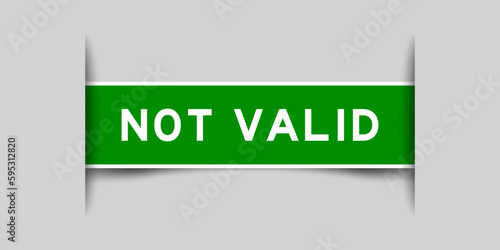 Green color square label sticker with word not valid that inserted in gray background