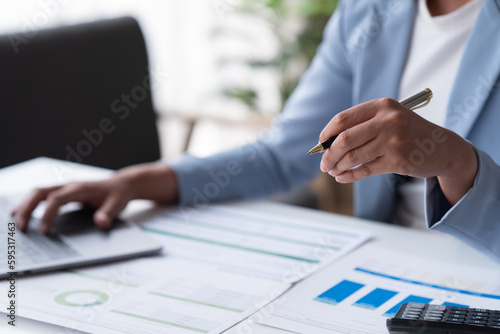 Fototapeta Naklejka Na Ścianę i Meble -  Accountant analyzing business marketing data on paper dashboard Corporate finance office table. 
