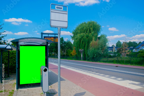 empty billboard with chroma key at european bus stop, advertisement concept