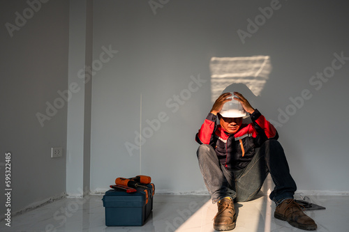 Male engineers feel tense and hopeless at the stressful situation in the factory. construction site cause workers to lose their jobs recession crisis failed business