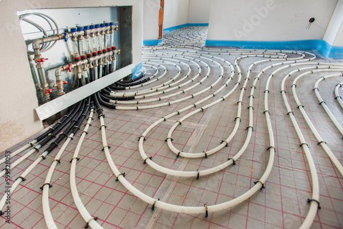 underfloor heating system in construction of new residential house photo