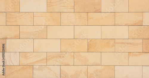 Quadro su tela texture of a tiled beige stone wall as background, natural stone wall texture as background