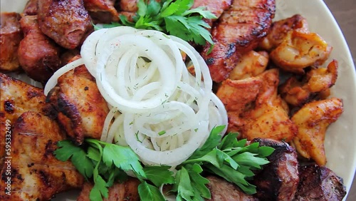 Close-up of an assortment of grilled meats, smooth camera movement, selective focus.