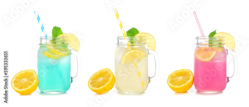 Cold, colorful summer lemonade drinks in mason jar glasses with lemons. Blueberry, lemon and strawberry in mason jar glasses isolated on a white background.
