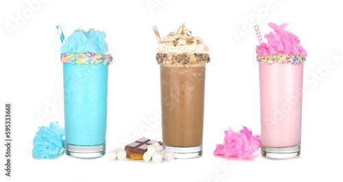 Fun colorful summer milkshakes isolated on a white background. Blue and pink cotton candy and chocolate smores sweet drinks with ingredients.