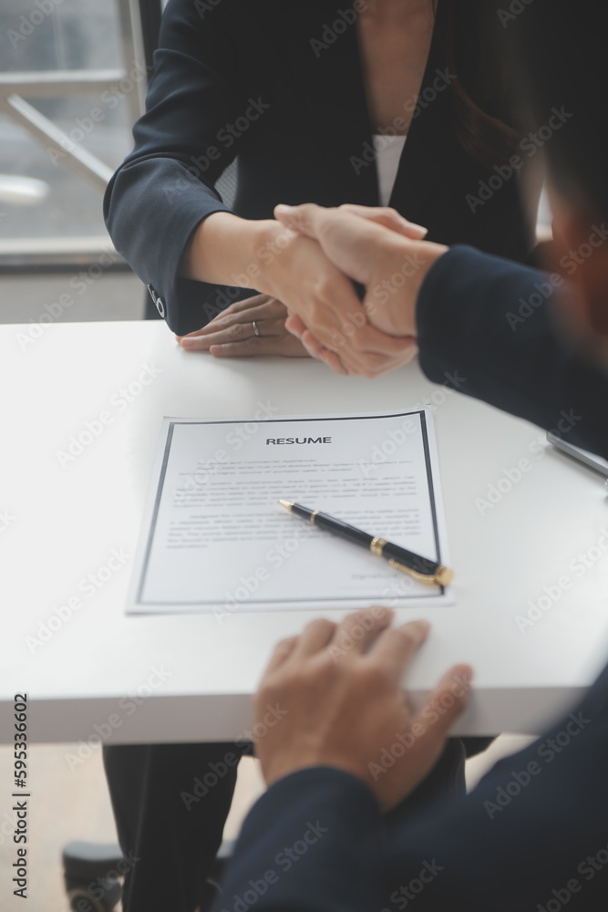 Businessman or job seeker review his resume on his desk before send to finding a new job with pen, necktie, glasses and digital tablet. Businessman or job seeker review his resume on his desk before send to finding a new job with pen, necktie, glasses and digital tablet.