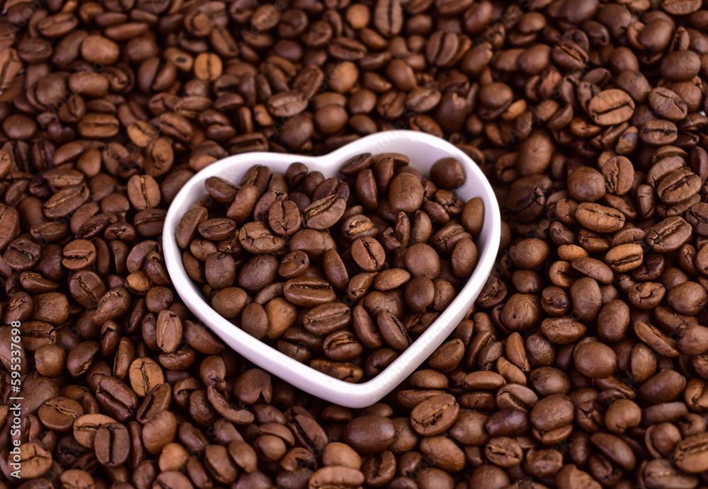 Coffee beans and a plate in the shape of a heart.Coffee beans in the shape of a heart.
Coffee beans and a plate in the shape of a heart.Coffee beans in the shape of a heart.