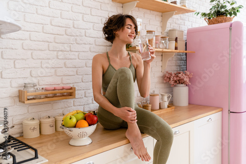 healthy slim woman in kitchen in the morning, diet food wellness