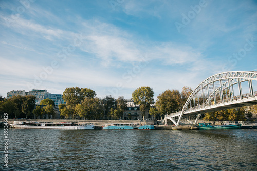 Looking Out across the Seine river to the riverbank and buildings on a clear day © MylesK