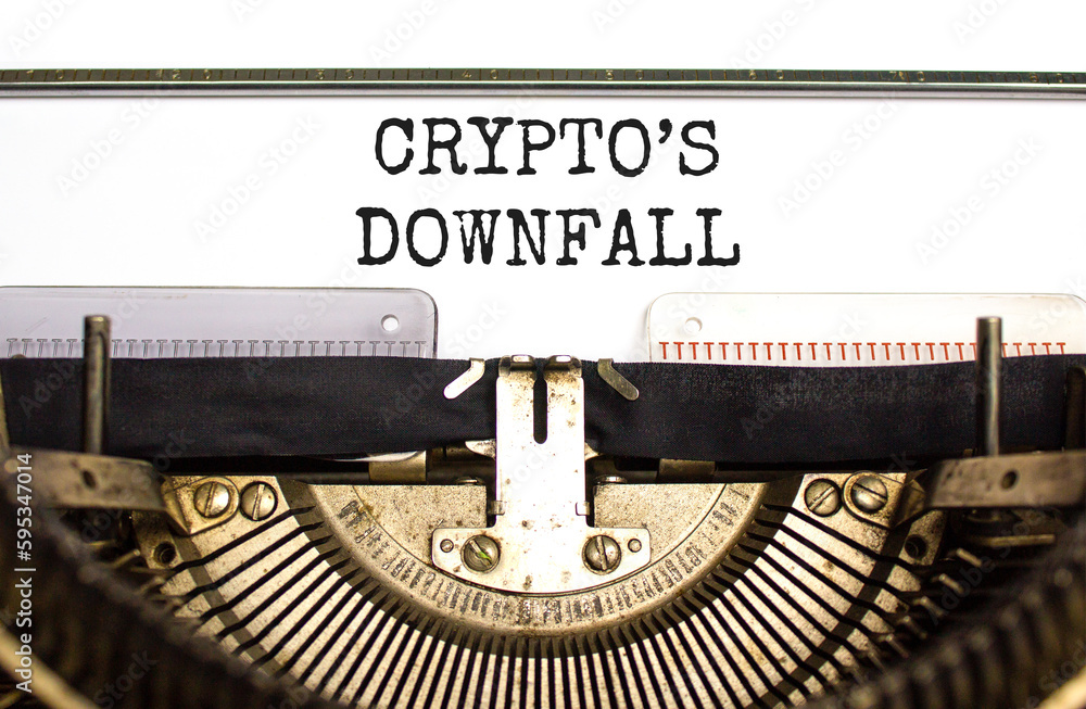 Crypto downfall symbol. Concept words Cryptos downfall typed on old retro typewriter. Beautiful white background. Business and crypto downfall concept. Copy space.