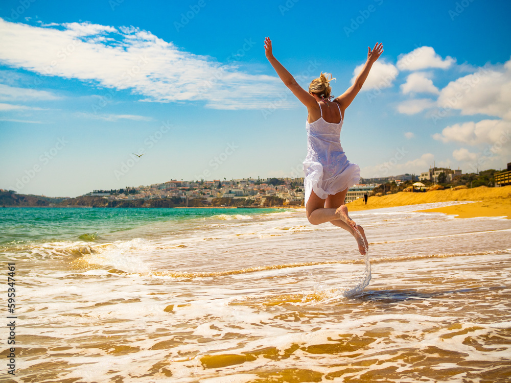 Beautiful woman walking on sunny beach
Beautiful woman walking on sunny beach